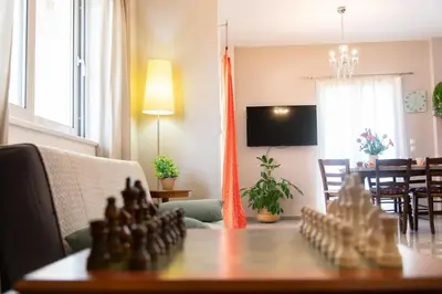 a living room with a chess board on a table at Kadiani's Residence by 8essentially in Chania Town