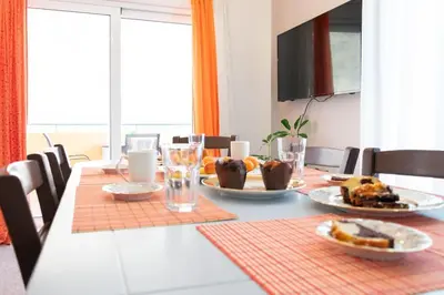 a dining room table with plates of food on it at Kadiani's Residence by 8essentially in Chania Town