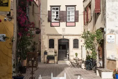 an alley in an old town with a building at Harismari Cozy Hotel in Chania Town