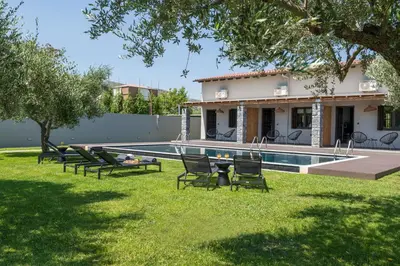 a house with a swimming pool in a yard at Eightyfour Living with private pool in Chania Town