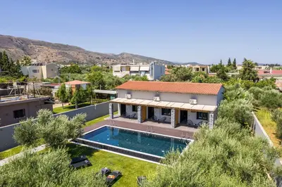 an aerial view of a house with a swimming pool at Eightyfour Living with private pool in Chania Town