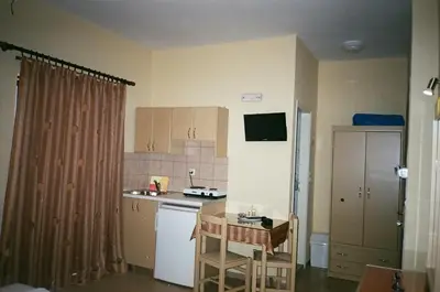 a small kitchen with a sink and a stove at John Apartments in Plataniás