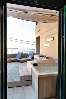 a kitchen and living room on a yacht at Elia Beach Deluxe Apartment in Chania Town