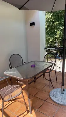 a table and chairs sitting on a patio at Emerald Suites in Vryses