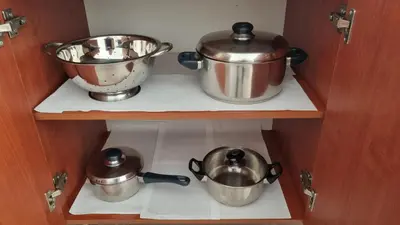 two pots and pans on a shelf in a kitchen at Casa Artemis in Plátanos