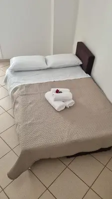 a bed with two towels on top of it at Casa Artemis in Plátanos