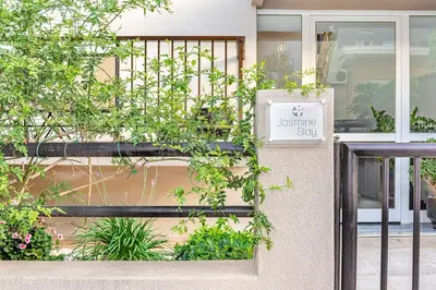 a sign on the side of a building at JasmineStay - Two bedroom apartments with backyard in Chania Town