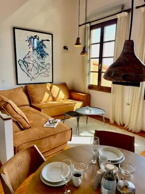 a living room with a table and a couch at Erietta Suites in Chania Town
