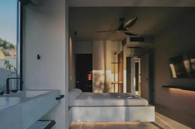 a bedroom with a bed and a ceiling fan at Inspiration House in Souda