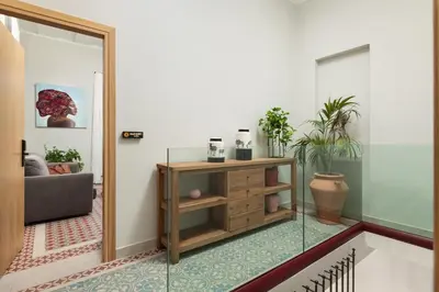 a living room with a glass entry way at The Alma City Suites in Chania Town