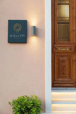 a door and a sign on the side of a building at The Alma City Suites in Chania Town