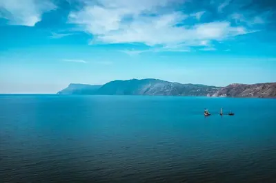 a large body of water with two boats in it at Suite Erato in Kissamos