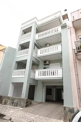 a large white building with white balconies on it at Koum Kapi Studio B1 in Chania Town