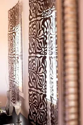 a wall with a black and white patterned curtain at Kronos Villas in Kolymvari