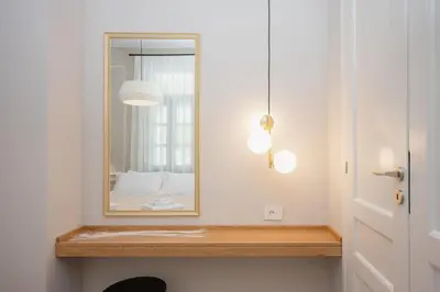 a mirror sitting on a shelf in a bathroom at Villa Kalliopi in Chania Town