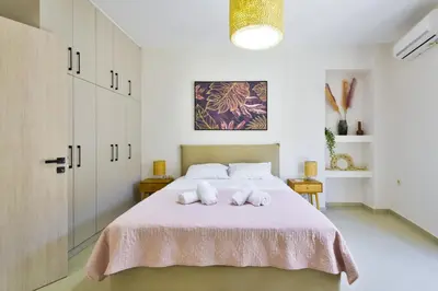 a bedroom with a bed with two towels on it at Lazareta 3 in Chania Town