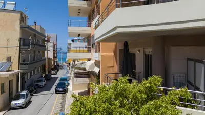 a city street with cars parked on the street at Lazareta 3 in Chania Town