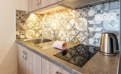 a kitchen with a sink and a counter top at Kaiti 's Studios & Apartments in Palaiochóra