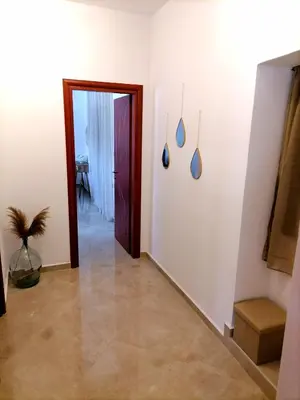 a room with a hallway with a door and a plant at VILLA HALEPOURI in Chania Town