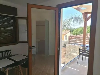 a sliding glass door with a view of a balcony at Halepouri Apartment in Chania Town