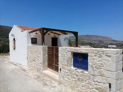 a building with a sign on the side of it at Halepouri Apartment in Chania Town