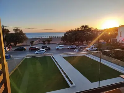 a view of a parking lot with cars parked at Ammos Paleochora Hotel in Palaiochóra