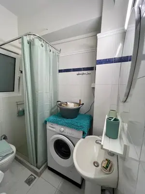a bathroom with a washing machine and a sink at Domus Bettolo in Chania Town