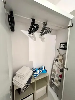 a walk in closet with black and white umbrellas at Domus Bettolo in Chania Town