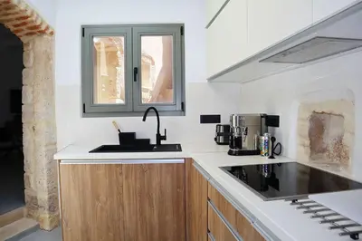 a kitchen with a sink and a microwave at Porto 57 in Chania Town