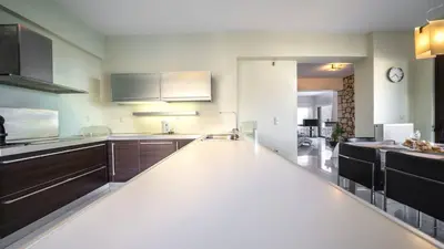 a kitchen with a large white counter top at Villa Majestic Crete heated pool and sauna in Megála Khoráfia
