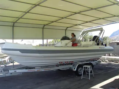 a woman sitting in a boat on a trailer at VILLA ROTUNDA B in Chania Town