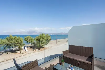 a balcony with a view of the beach and the ocean at Alexia Seaview Apartments in Kissamos