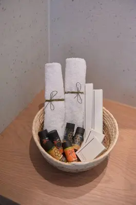 a basket on a table with towels and candles at Orfeas Apartment in Chania Town
