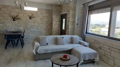 a living room with a couch and a table at Ioanna Apartment 2 in Chania Town