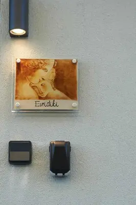 a sign on a wall that says emililus at Evridiki Apartment in Chania Town