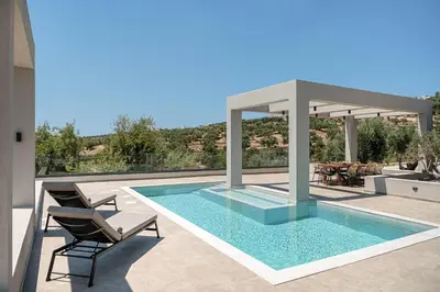 a swimming pool on the roof of a house at Sunny Vacay Villa in Stérnai