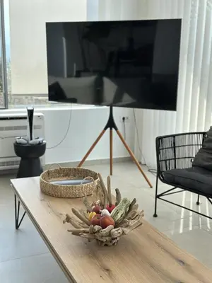 a basket of vegetables on a table in a living room at Sunny Vacay Villa in Stérnai