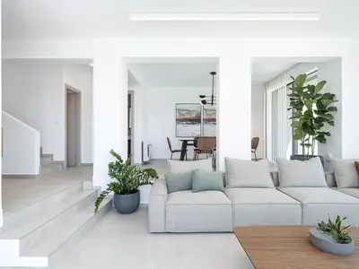 a white living room with a couch and plants at Sunny Vacay Villa in Stérnai