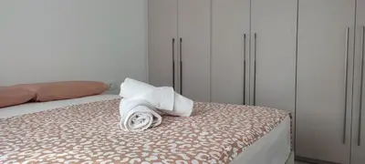 a bed with a towel sitting on top of it at Hellene Αpartment near Chania City Centre in Chania Town