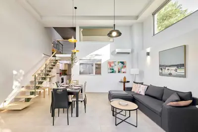 a living room with a couch and a table at Renia's house in Daratso