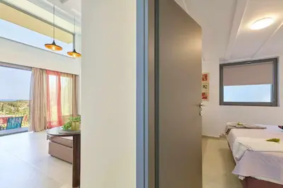 a bedroom with a bed and a window and a door at Renia's house in Daratso