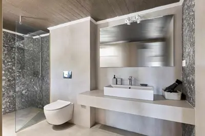 a bathroom with a sink and a toilet and a shower at Renia's house in Daratso