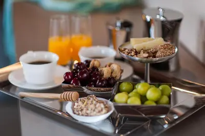 a tray filled with different types of food on a table at Serenissima Boutique Hotel in Chania Town