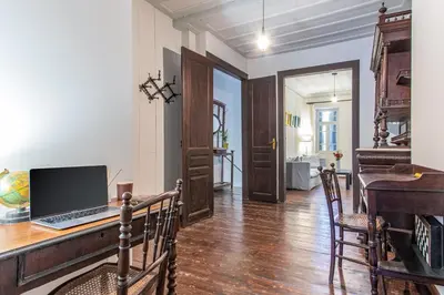 a room with a desk with a laptop computer on it at Casa Ari - Venetian Port in Chania Town