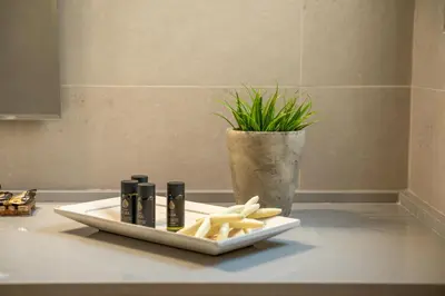 a plate of food on a counter in a bathroom at Koutris Apartment 2 in Falasarna
