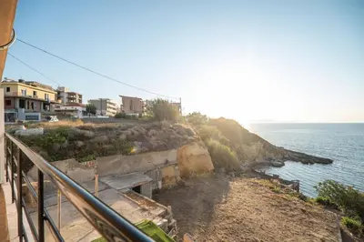 a view of the ocean from a balcony at Sea Gem family in Chania Town