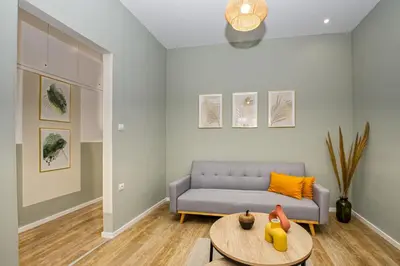 a living room with a couch and a table at Callisto House in Kalyves in Kalyves
