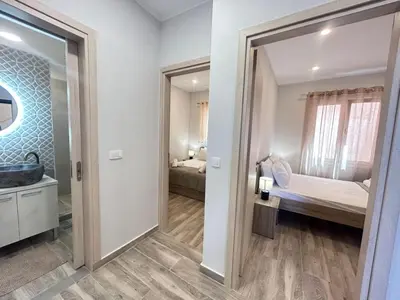 a bathroom with a door leading to a bedroom at Venetian Kamara in Old Town Chania in Chania Town