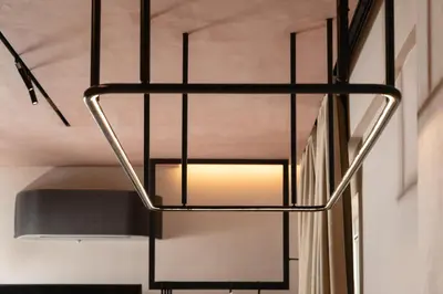 a metal staircase with a light hanging from the ceiling at D-Loft Chania in Chania Town