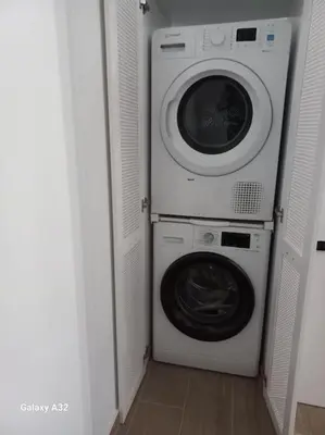 a washing machine and a dryer in a room at Central City Loft by NEK in Chania Town